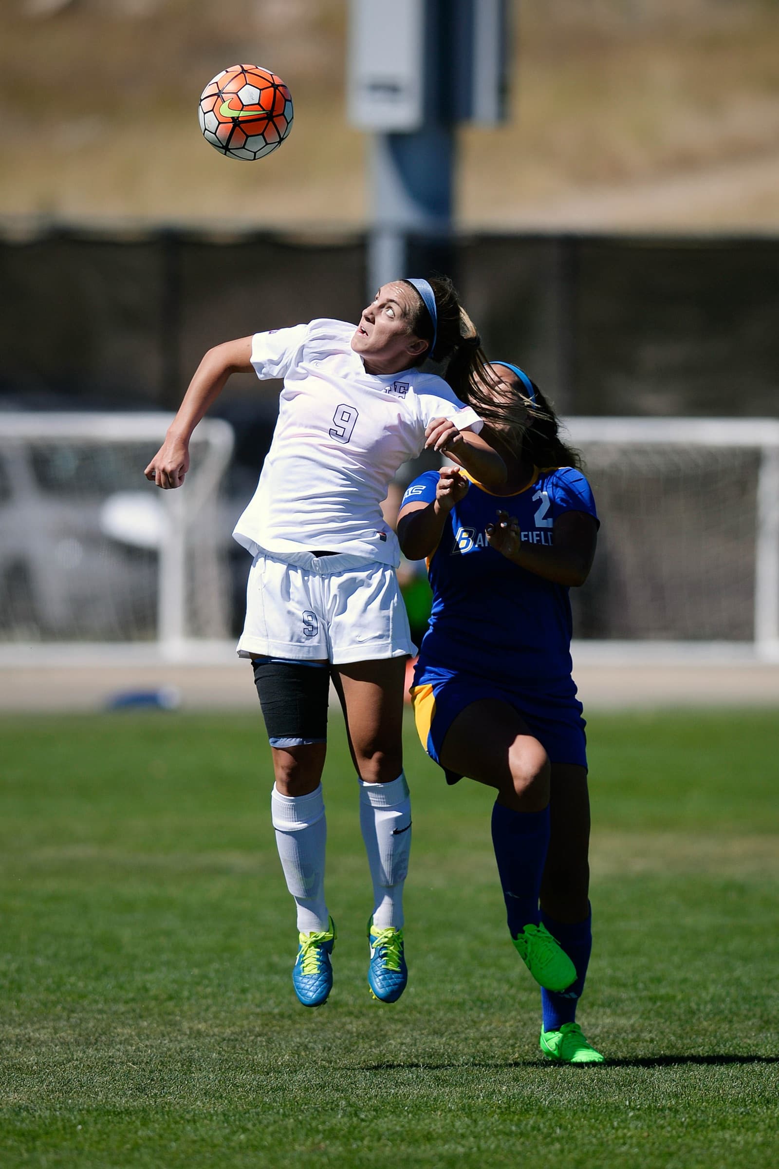 An Air Force Academy women's player going up for a header against Cal State Bakersfield