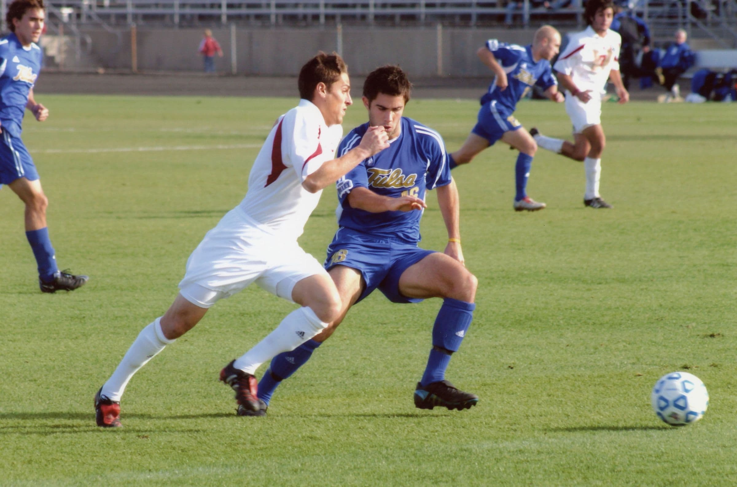 An Indiana men's player moving the ball forward against Tulsa