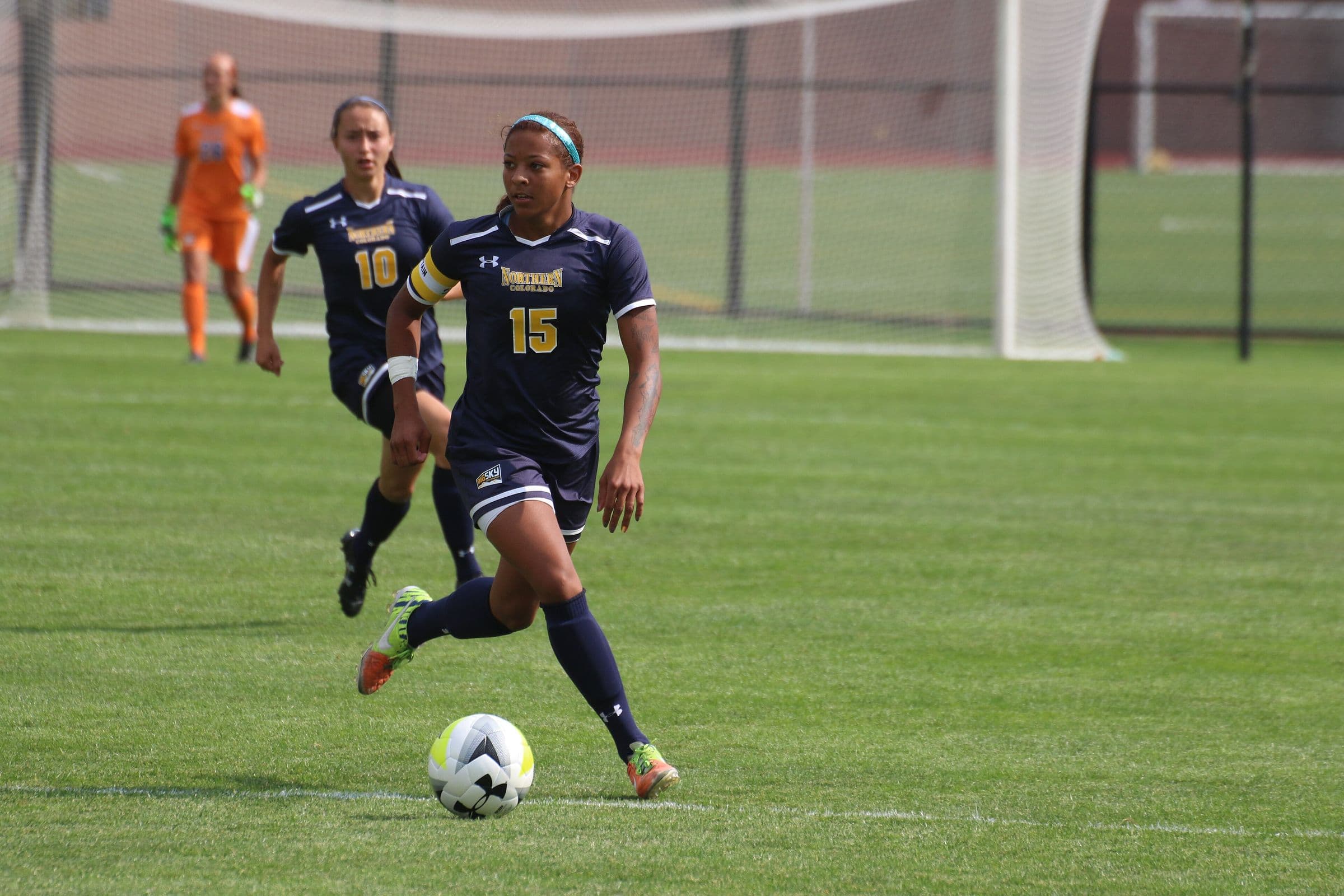 A Northern Colorado women's player dribbling upfield
